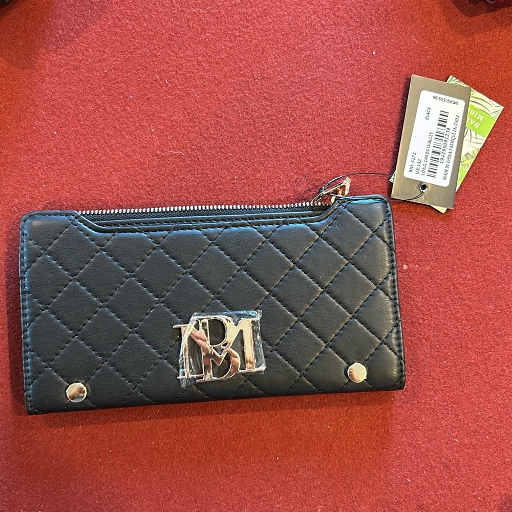 Two pack Badgley mischka black long card wallet msrp $59. Two wallets wholesale